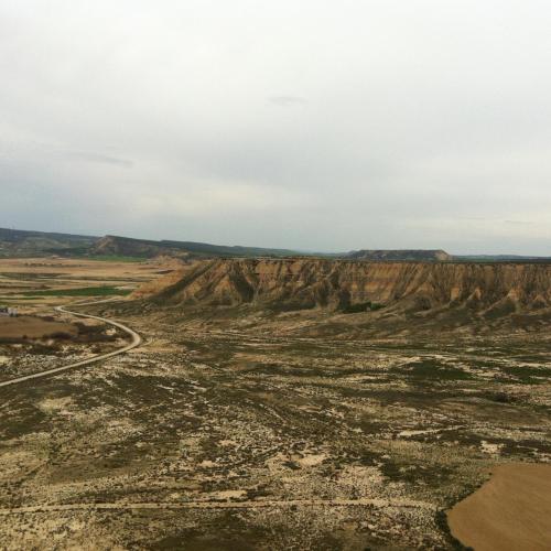 an aerial view of a desert with mountains and a road at Apartamento Rural El Estrecho de Arguedas in Arguedas