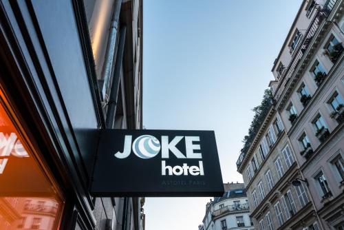a sign for a joker hotel on the side of a building at Hotel Joke - Astotel in Paris