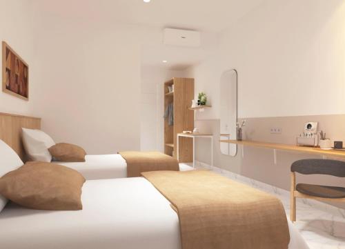 a hotel room with three beds and a kitchen at Freddies Santai Sumurtiga in Sabong