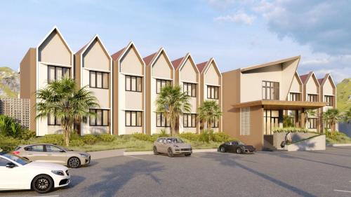 a rendering of a building with cars parked in a parking lot at Freddies Santai Sumurtiga in Sabong