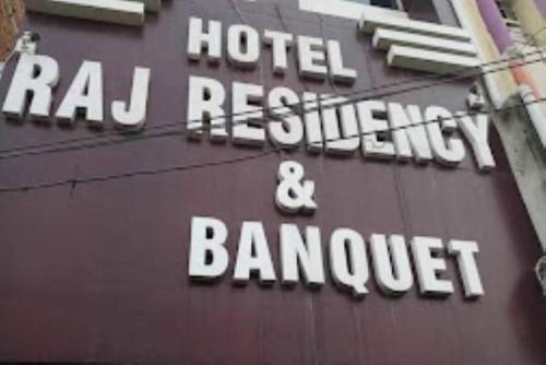 a sign for a hotel restaurant and banquet at Hotel Raj Residency, Patna in Patna