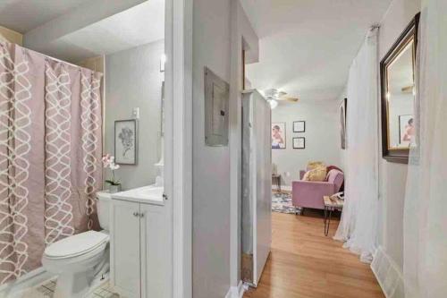 a white bathroom with a toilet and a sink at 2 Bdrm Perfectly Located In Charming Bella Vista in Philadelphia
