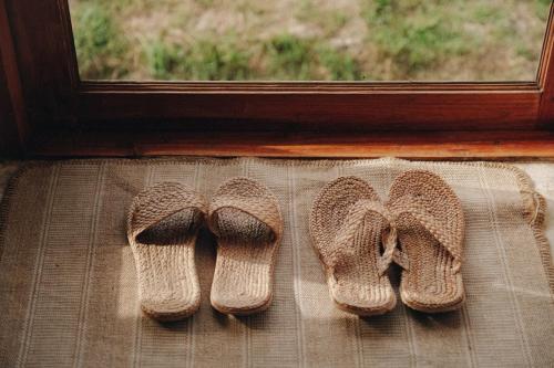 a pair of socks sitting on a window sill at บ้านนาก๋างโต้ง Baan Na Kang Tong in Ban Kot