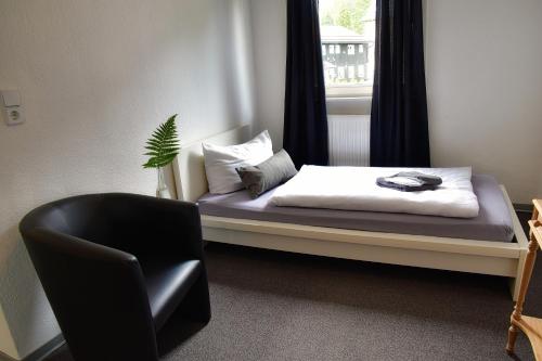 Кровать или кровати в номере Hotel Rosenhof Braunlage