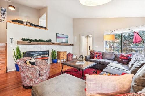 a living room with a couch and a fireplace at Park Forest Estates in Breckenridge