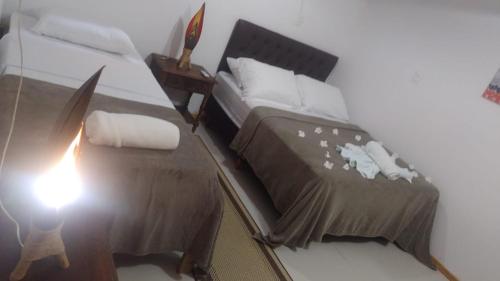 Een bed of bedden in een kamer bij Casa Sol do Gostoso