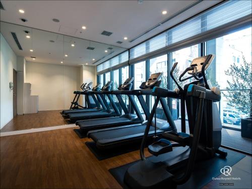 a row of treadmills in a gym at DEL style Osaka-Shinsaibashi by Daiwa Roynet Hotel in Osaka