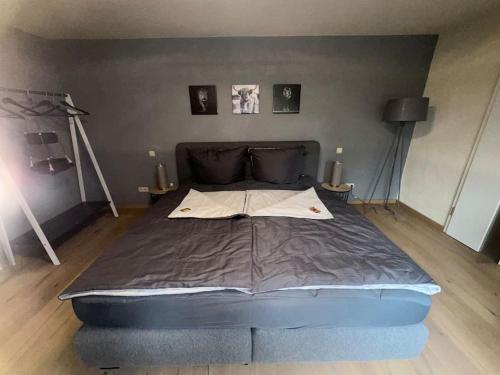 a large bed in a room with at Palais -MehrGehtNicht-Maisonette in Großweitzschen