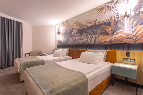 Katil atau katil-katil dalam bilik di Best Western Plus Khan Hotel