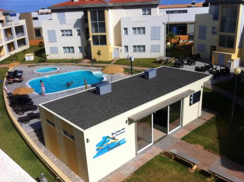 an aerial view of a building with a swimming pool at Paraiso Dourado in Porto Santo