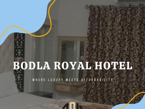 木爾坦的住宿－Bodla Royal Hotel，一间有窗帘的酒店的一个标志