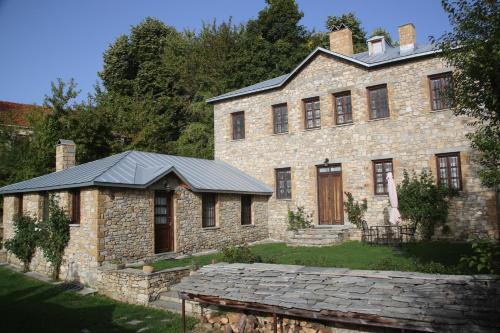 an old stone house with a slate roof at Guesthouse Kontogianni - Materka in Nymfaio