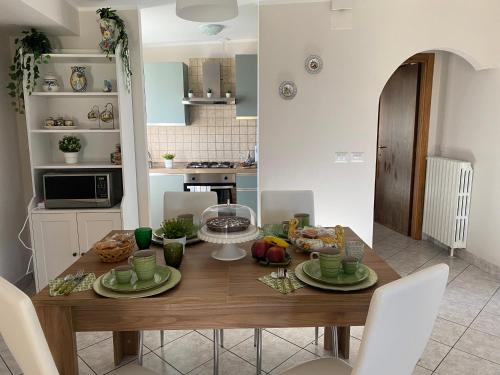 a kitchen with a wooden table with food on it at Matteo's House in Penne