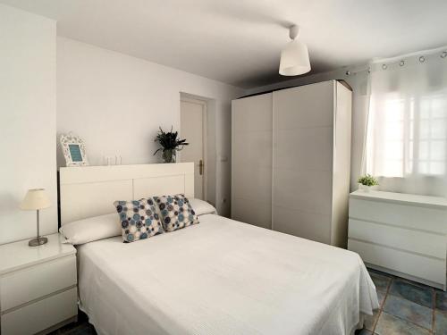 Posteľ alebo postele v izbe v ubytovaní La Casita del Faro