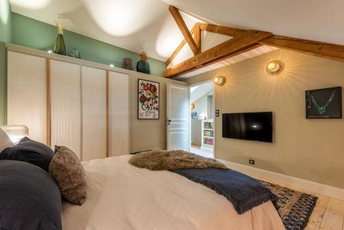 En eller flere senge i et værelse på Sublime duplex 100m2 Villa classée