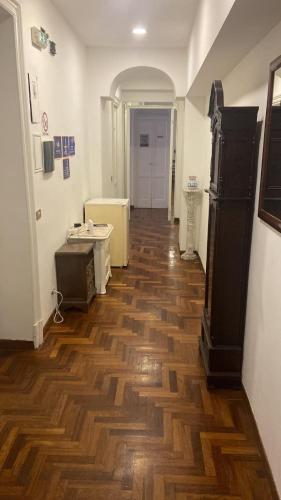 a hallway with a wooden floor in a room at Colosseum Point in Rome