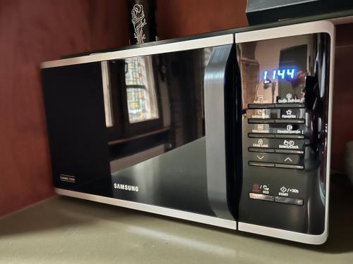 a microwave oven sitting on top of a counter at LOFT d'O in Ypres