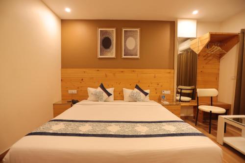 a bedroom with a large bed in a room at The Grand Uddhav- a boutique hotel in Udaipur