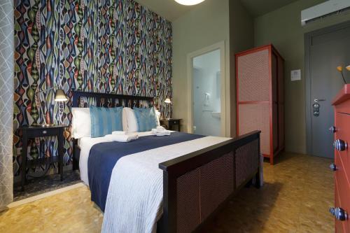 Letto o letti in una camera di GUEST HOUSE SONNINO 37 Cagliari