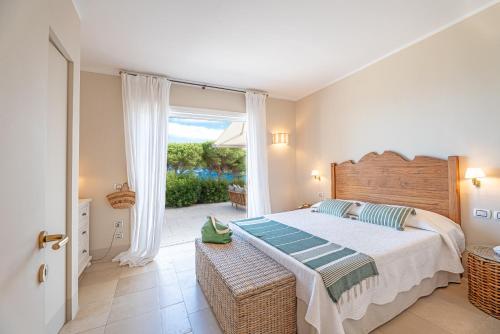 En eller flere senge i et værelse på Villa Ondina