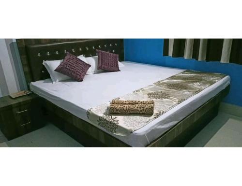 מיטה או מיטות בחדר ב-Motel Highway Inn,Sasaram