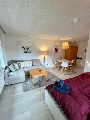 a living room with a couch and a table at Nassfeldblick in Kirchbach