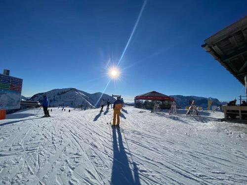 a group of people skiing on a snow covered slope at Nassfeldblick in Kirchbach