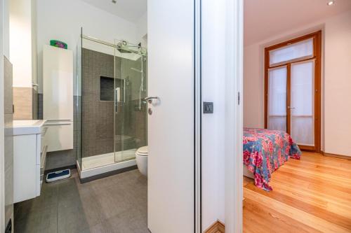 a bathroom with a shower and a toilet in a room at Quiet house in a lively area! in Milan