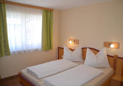 Postel nebo postele na pokoji v ubytování Appartements Real
