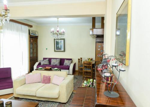 a living room with a couch and a table at Maria's House in Alexandroupoli