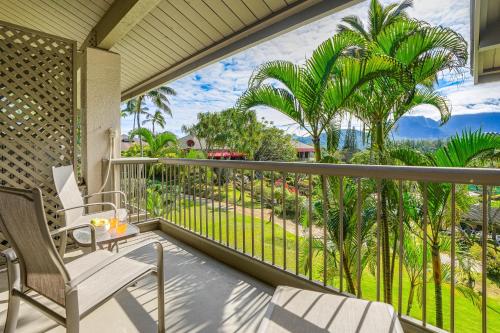 a balcony with a view of the ocean and palm trees at Hanalei Bay Resort 2301 two in Princeville
