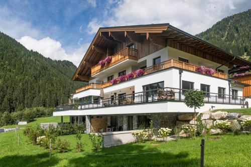 a large building with balconies on a mountain at BergLeben Zaglauhof in Werfenweng