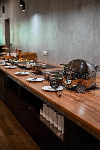 a long table with a helmet on top of it at MORVA Premium Spa Resort in Yaremche