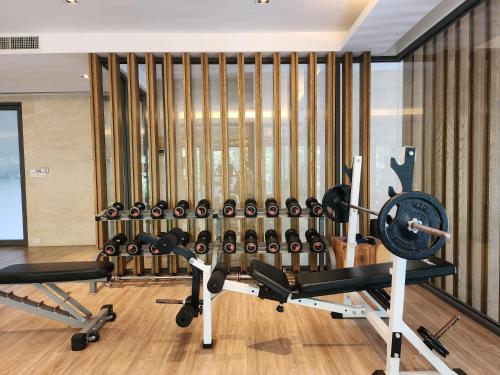 a gym with a lot of exercise equipment at Mountain View Suite at The Valley Khaoyai in Ban Huai Sok Noi