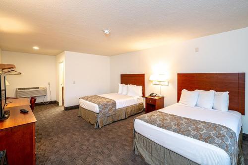 Letto o letti in una camera di Anchorage Motel Inc.