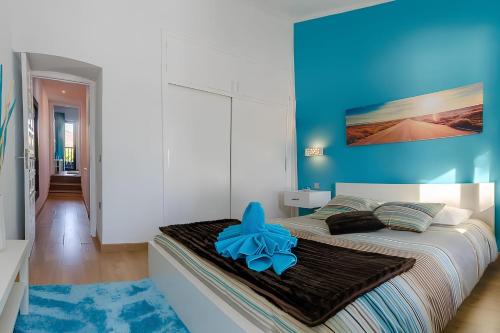 Tempat tidur dalam kamar di Agradable casa con entrada propia a la playa