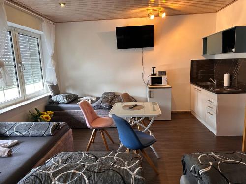 a small living room with a couch and a table at Familie Zimmer in Löhne