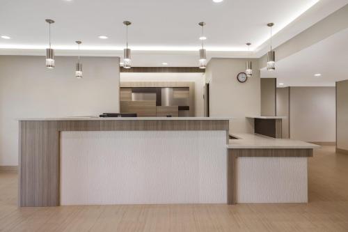 a kitchen with a large island in a room at Red Roof Inn Sulphur in Sulphur