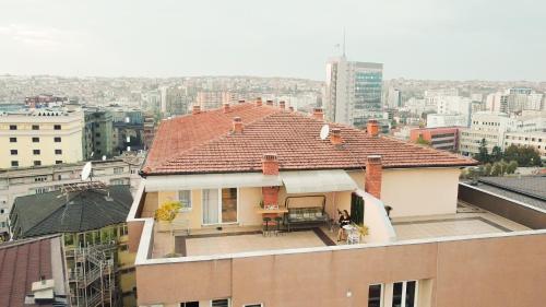 a house on top of a building in a city at Siera's Penthouse in Pristina