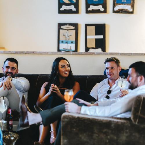 a group of people sitting on a couch at Castello di Baccaresca in Branca
