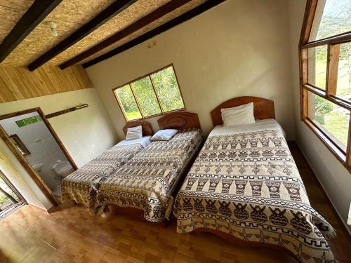 Postel nebo postele na pokoji v ubytování Lia B&B Lucmabamba