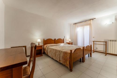 Postel nebo postele na pokoji v ubytování Argentario Giannella Apartment