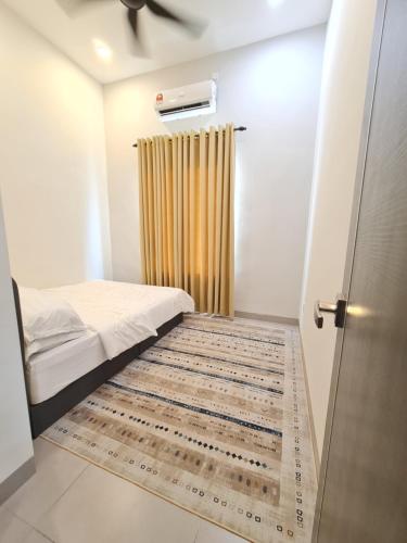 a small bedroom with a bed and a curtain at One Sweet Homestay Kulim Hi-Tech utk Msliim shj in Kulim