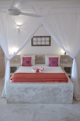 Ένα ή περισσότερα κρεβάτια σε δωμάτιο στο Sharazad Oasis Retreat