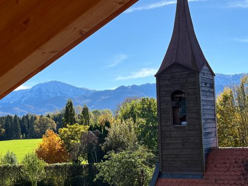 a chapel with a view of the mountains at Chiemgauloft am Chiemsee in Übersee