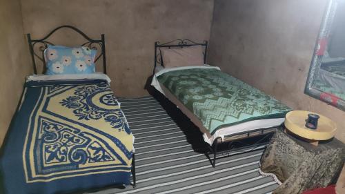 Tempat tidur dalam kamar di Camp & Trek
