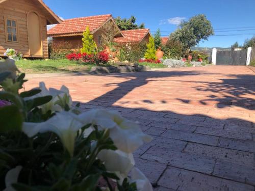 a brick driveway in front of a house at Cabañas Villa Isabel in Cajicá