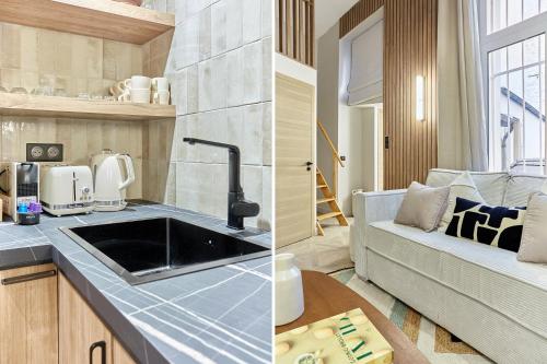 a kitchen with a sink and a living room with a couch at Apartment Batignolle Montmartre by Studio prestige in Paris