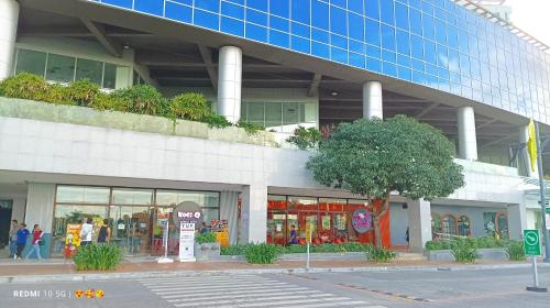 a store front of a building on a city street at Mactan Newtown Beach Condo in Mactan