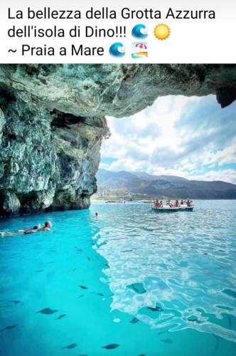 a picture of a cave in the water with a boat at Relax in Casa Domi in Scalea